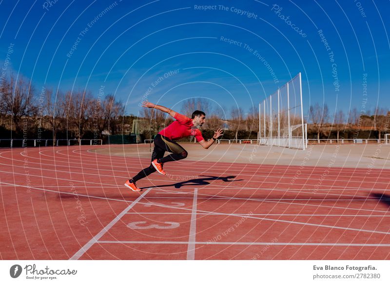 young athlete man running in the lanes Lifestyle Leisure and hobbies Sports Track and Field Jogging Masculine Young man Youth (Young adults) Man Adults 1