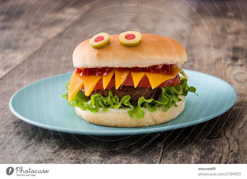 Halloween burger monsters on wooden table. Hallowe'en Beef Bread Feasts & Celebrations Cheese Dinner Autumn Food Healthy Eating Food photograph Funny Ketchup