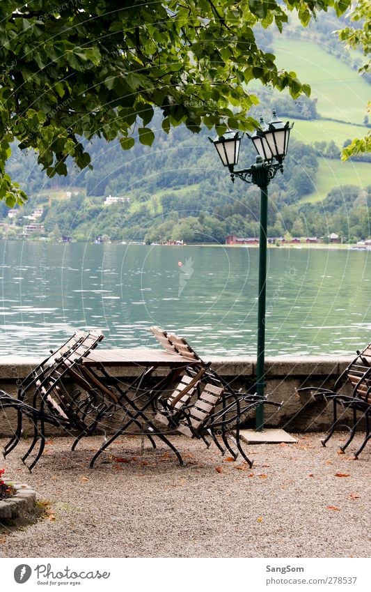 Lake Zell Water Alps Zell lake Austria Wall (barrier) Wall (building) Vacation & Travel Lamp post Garden chair Green Calm Lakeside Freshwater Mountain