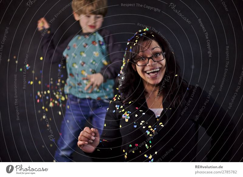 Confetti | Child throws woman with confetti Human being Boy (child) Woman Adults 2 3 - 8 years Infancy 30 - 45 years Eyeglasses Laughter Throw Authentic