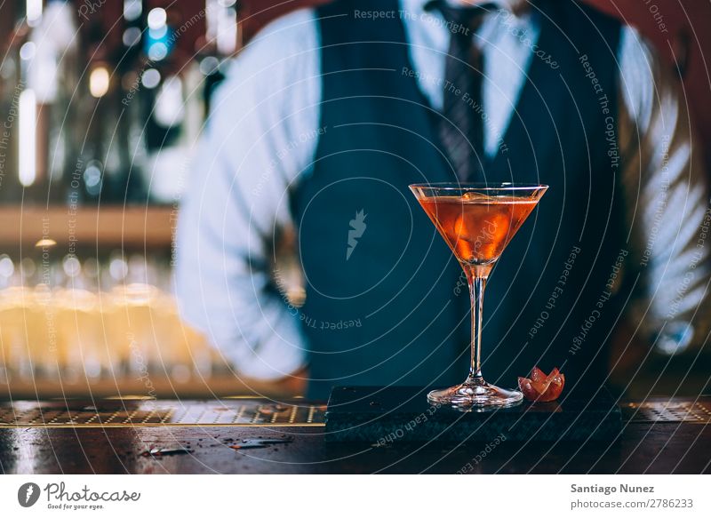 Barman is making cocktail at night club. Cocktail shaker barman bartender Waiter Man Stir mixologist adding Alcoholic drinks Business Club Drinking Bottle