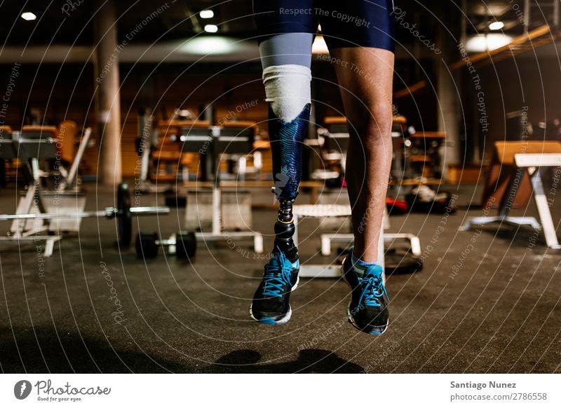Close up of prosthesis leg of young man training in the gym. Man Youth (Young adults) Athlete Sports prothestic Portrait photograph Handicapped disabled