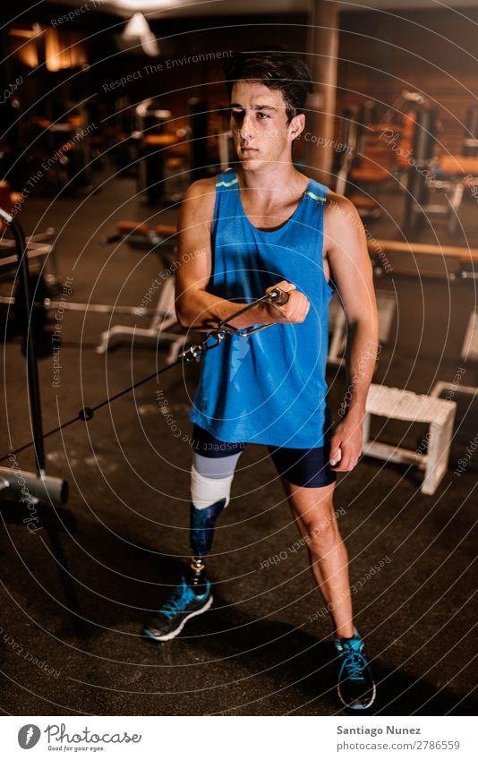 Disabled young man training in the gym. Man Youth (Young adults) Athlete Sports prothestic Portrait photograph Handicapped disabled Practice Fitness Gymnasium