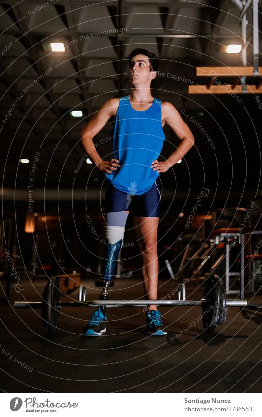 Portrait of disabled young in the gym. Man Youth (Young adults) Athlete Sports prothestic Portrait photograph Handicapped paralympic Fitness Gymnasium Action