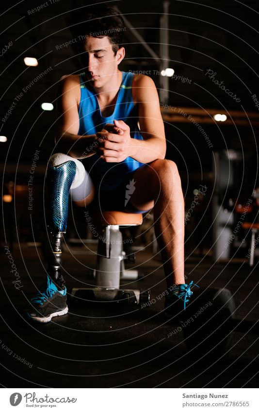 Portrait of disabled young man in the gym. Man Youth (Young adults) Athlete Sports prothestic Portrait photograph Handicapped Fitness Gymnasium Action Legs