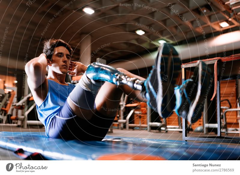 Disabled young man training in the gym Man Youth (Young adults) Athlete Sports prothestic Handicapped disabled abdominal paralympic Fitness Gymnasium Action
