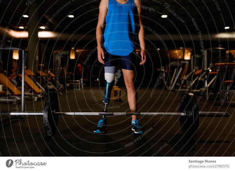 Portrait of disabled young in the gym. Man Youth (Young adults) Athlete Sports prothestic Portrait photograph Handicapped Fitness Gymnasium Action Legs amputate
