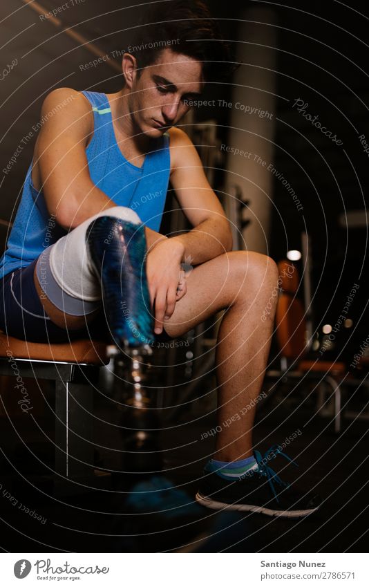 Portrait of disabled young in the gym. Man Youth (Young adults) Athlete Sports prothestic Portrait photograph Handicapped Fitness Gymnasium Action Legs amputate
