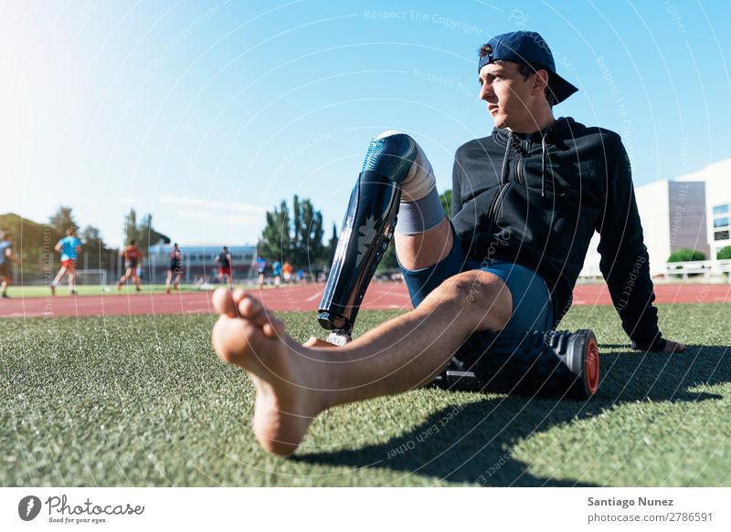 Portrait of disabled man athlete with leg prosthesis. Man Runner Portrait photograph Athlete Sports prosthetic Handicapped paralympic amputation Seat Sit