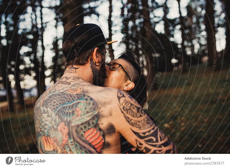 Man in tattoos holding hands of woman - a Royalty Free Stock Photo from  Photocase