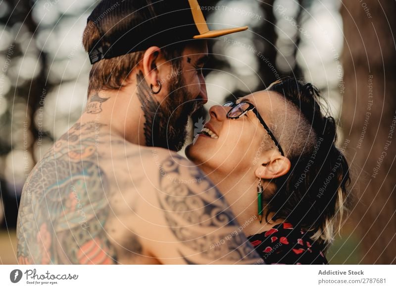Man in tattoos holding hands of woman - a Royalty Free Stock Photo from  Photocase