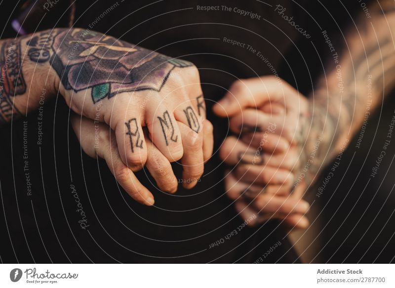 A woman's hands with tattoos and rings on them photo – Free Des moines  Image on Unsplash