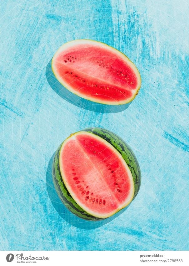 Pieces of watermelon on background painted in blue Fruit Nutrition Eating Vegetarian diet Diet Summer Fresh Delicious Natural Juicy Clean Green Red flat food