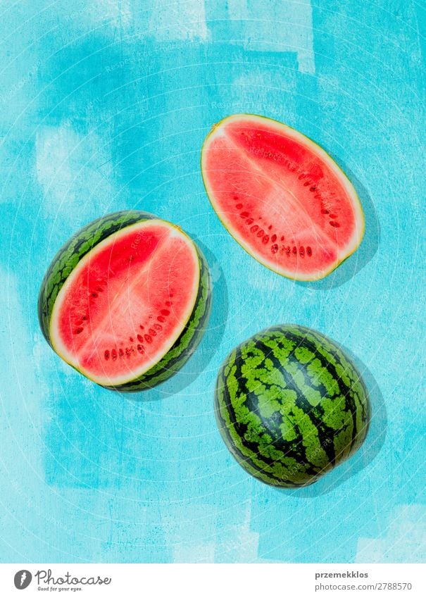 Pieces of watermelon on background painted in blue Fruit Nutrition Eating Vegetarian diet Diet Summer Fresh Bright Delicious Natural Juicy Clean Green Red flat
