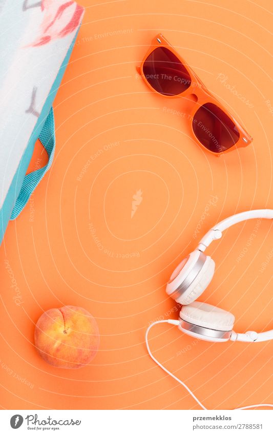 Sunglasses, headphones, peach, blanket on orange background Fruit Lifestyle Style Summer Fresh Orange food Headphones Minimal Peach Colour photo Exterior shot