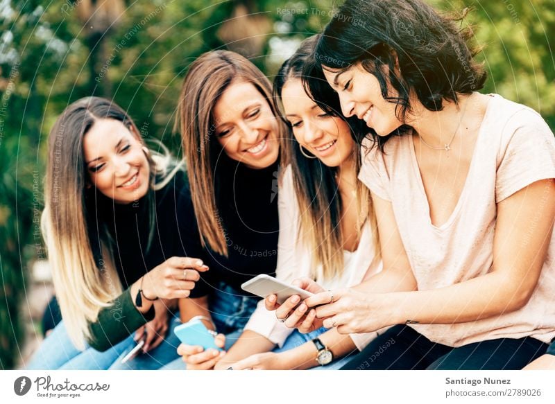 Big Group of friends using cellphones. Friendship Mobile Telephone PDA Human being Youth (Young adults) Woman Smart Technology Beautiful Lifestyle pretty