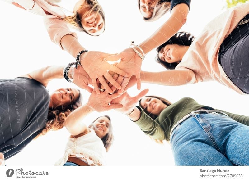 Friends with hands together. Adults American Easygoing Caucasian Close-up Friendship Smiling Happy Human being Conceptual design 6 Group Hand Idea Attachment