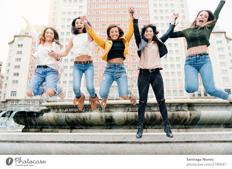 Women Jumping Friendship Happiness. Woman City Youth (Young adults) Joy Happy Street Summer Human being Girl Group Lifestyle Cheerful Easygoing Exterior shot