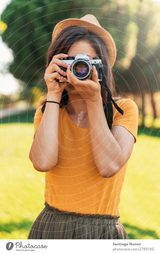 Young woman using a camera to take photo. Photographer Woman Photography Camera Youth (Young adults) Girl Digital White Leisure and hobbies 1 Take analogical
