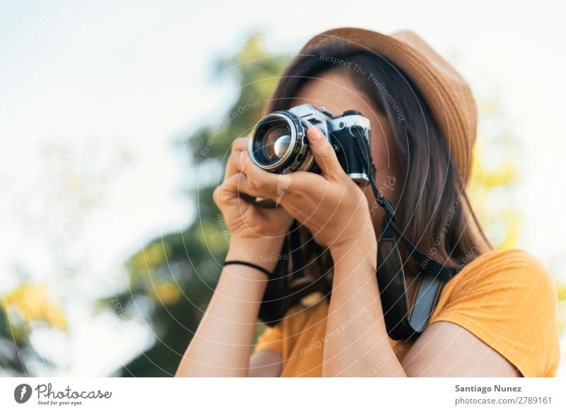 Young woman using a camera to take photo. Photographer Woman Photography Camera Youth (Young adults) Girl Digital White Leisure and hobbies 1 Take analogical