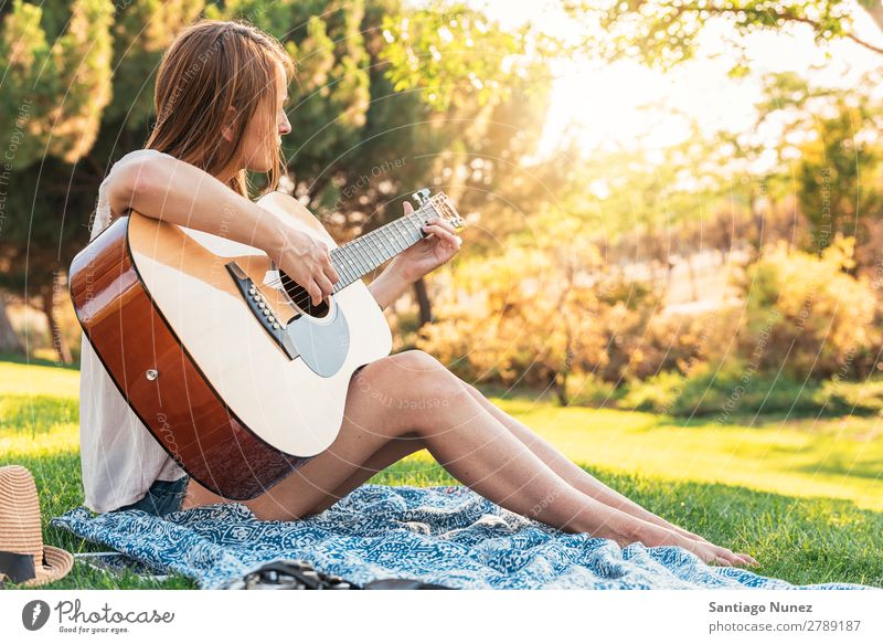 Beautiful woman playing guitar. Woman Picnic Youth (Young adults) Guitar Guitarist Park Happy Summer Human being Joy Playing Music Adults Girl pretty