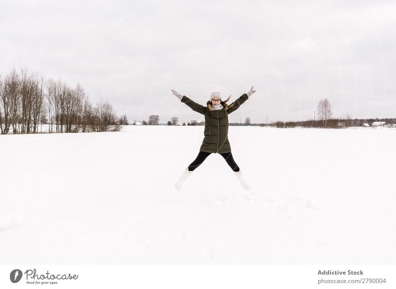 Woman jumping between snow field Snow Field Jump Winter Vilnius Lithuania having fun Wear Youth (Young adults) Lady Meadow Sky Clouds Cold Nature Happiness