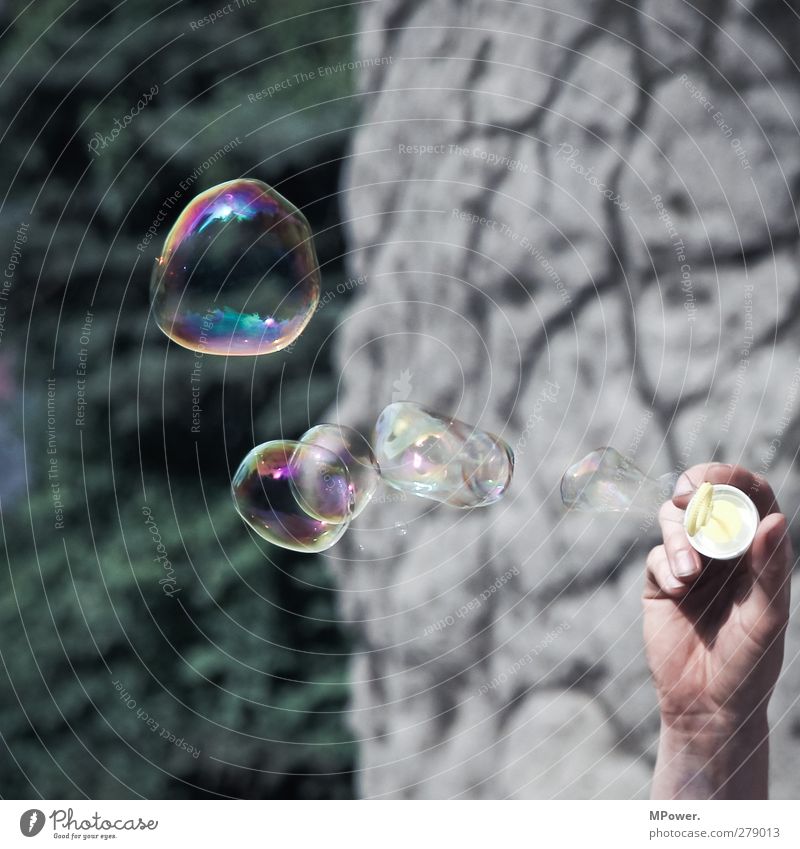 O oo o o o Human being Adults Hand 1 Crazy Soap bubble Toys Multicoloured Surface tension Fingers Playing Flying Colour photo Exterior shot