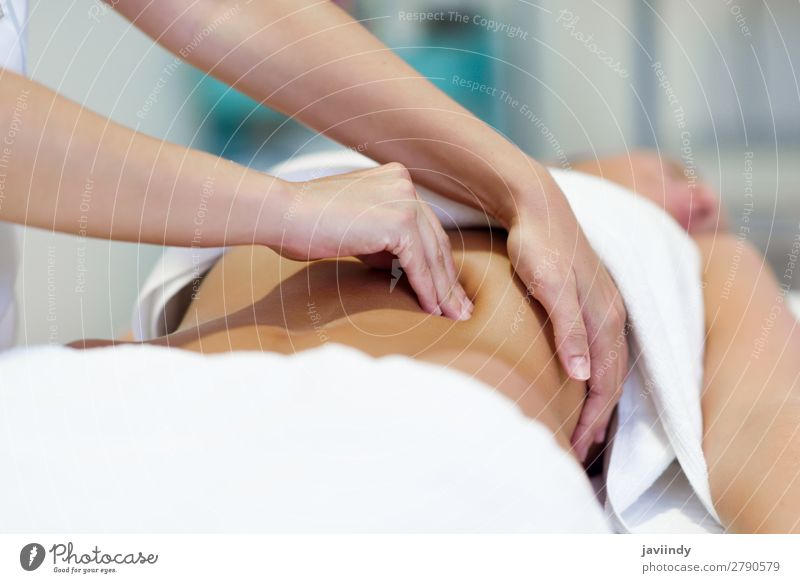 Woman having abdomen massage by professional therapist Lifestyle Beautiful Body Medical treatment Medication Wellness Relaxation Spa Massage Work and employment