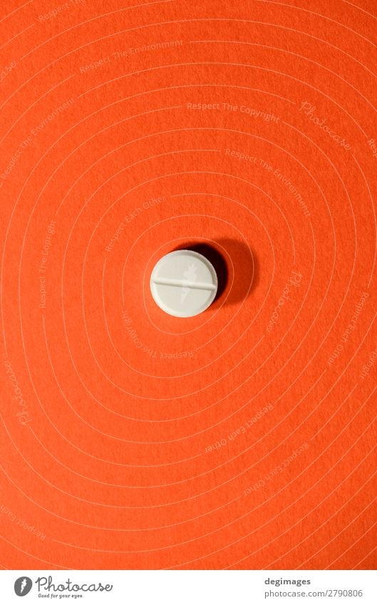 One white pill on orange background. Minimalist concep Health care Medical treatment Illness Medication Science & Research White Pain Pill medicine minimalist