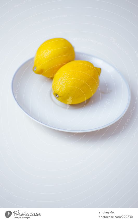 Two lemons. Life Sour Yellow Lemon Citrus fruits Plate Lie Food photograph Eating Minimalistic Delicious Fresh Organic produce 2 Edge of a plate Bright Round