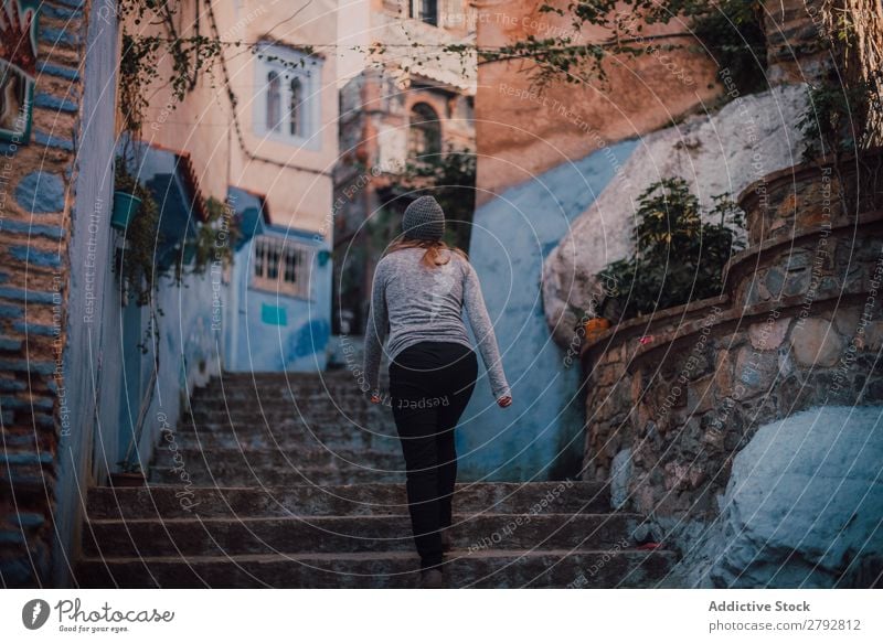 Woman walking upstairs on street Street Morocco Walking Hat Chechaouen Tradition Vacation & Travel Culture City arabic Town Multicoloured Tourism