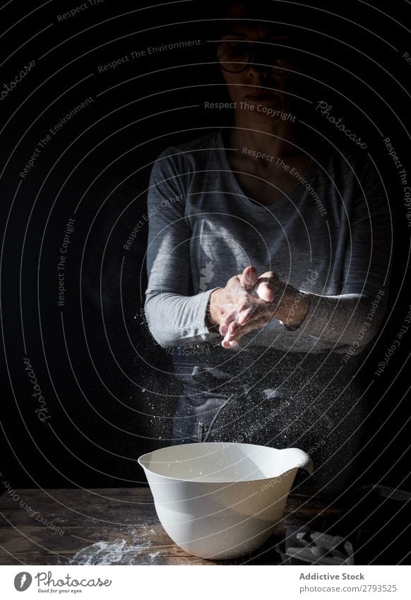 Woman clapping hands in flour near bowl and pack of eggs on table Hand Flour Bowl Egg Pack Table Applause Beater Wood Meal Craft (trade) Tasty Baked goods Lady