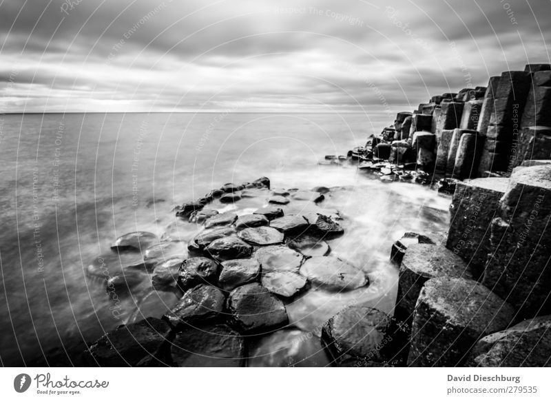 Place of relaxation Vacation & Travel Sightseeing Ocean Waves Landscape Sky Clouds Weather Rock Coast Black White Northern Ireland Giant´s Causeway Stone Water