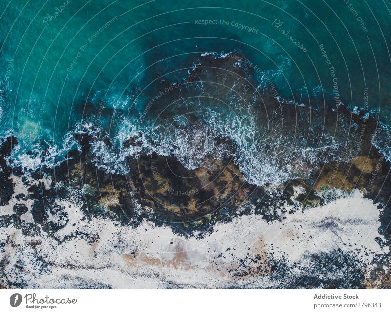 Amazing shoreline of ocean from drone Coast drone view Ocean Cliff Landscape Majestic Spain las palmas Fuerteventura Aircraft Nature Water Waves Power Turquoise