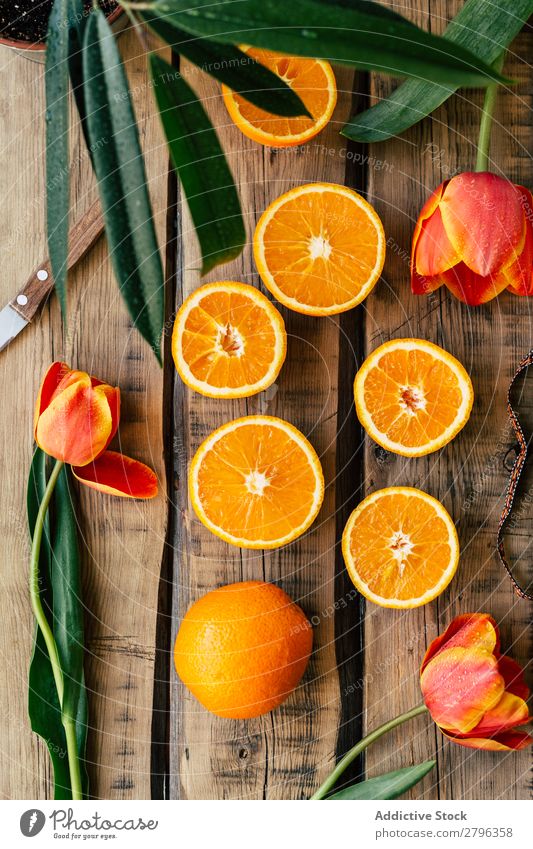 Tulips and oranges composition Orange Table Plant Pot Knives Spring Flower Floral Fresh Natural Organic Seasons decor Wood Timber Surface slices whole Mature