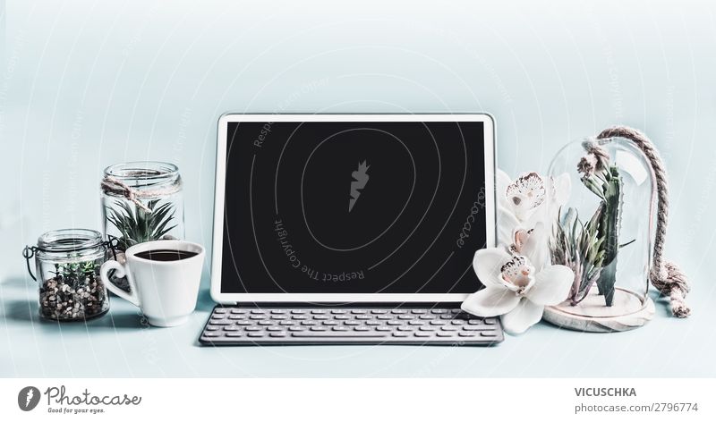 Laptop mock up on desktop with plants and coffee cup - a Royalty Free Stock  Photo from Photocase