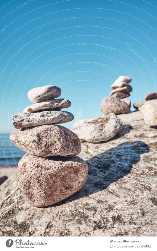 Stack of stones on a beach. Harmonious Contentment Relaxation Meditation Summer Beach Nature Sky Rock Stone Peace Serene Balance filtered Effect simplicity