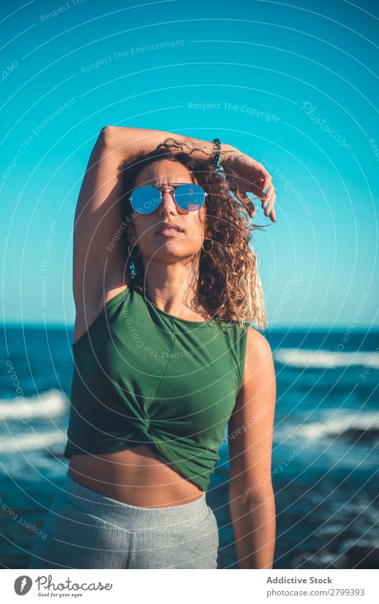Stylish woman standing near sea Woman Ocean Coast Dream Stand Lifestyle Leisure and hobbies Rest Relaxation Waves Water Style Hip & trendy Easygoing Sunglasses
