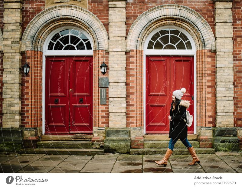 Woman passing red doors Tourist Street Walking York England Vacation & Travel Tourism City Youth (Young adults) Human being Lifestyle Backpack Door Red Building