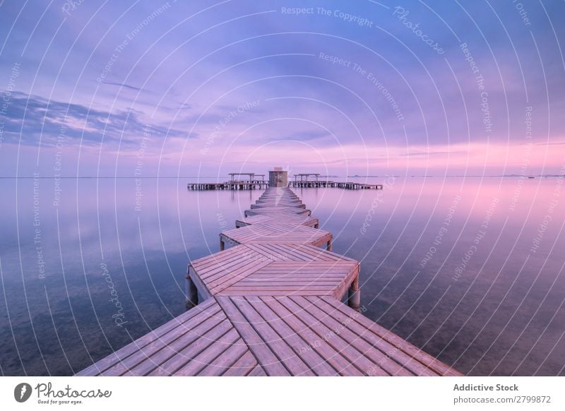 Wooden pier on cloudy evening Jetty Ocean Water Clouds Sky Calm mar menor murcia Spain Vacation & Travel Trip Evening Nature Harmonious Idyll Weather Tourism