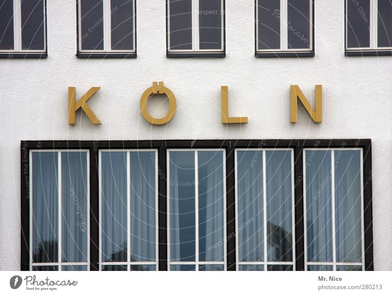 K Ö L N Town Manmade structures Building Architecture Facade Window Yellow Gold Cologne Logo Office building Industrial site Old building Pane Window pane