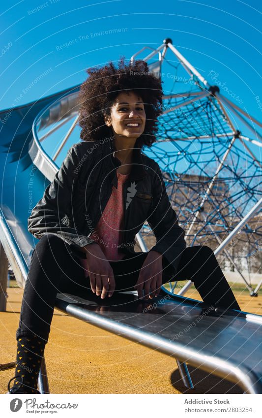 Woman with afro hair jumping down a slide. Adults African American Beautiful Black Farm Flag Girl Happy Hold Model Human being Stars states Wrap