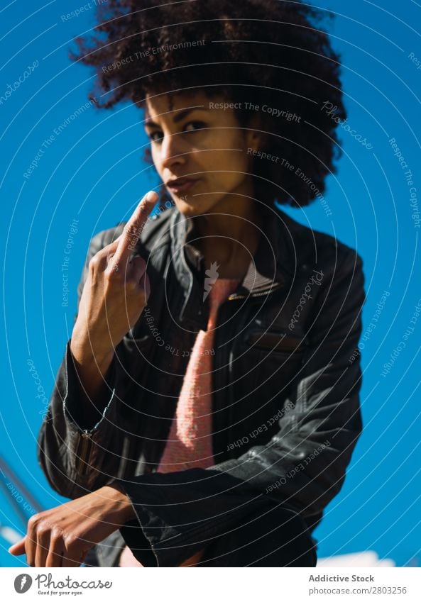 Woman with afro hair making insults. Adults Aggression Aggressive Anger attitude Bad Conceptual design Expression Fingers Gesture Girl Hand Human being Middle