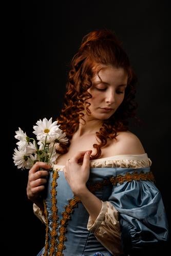 Beautiful woman in medieval clothing Woman Baroque Dress Hold Flower daisies Carnival Renaissance Princess Royal masquerade Fantasy Clothing aristocrat Fashion