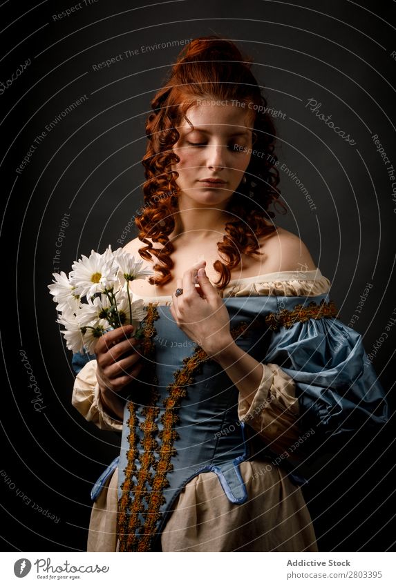 Baroque woman with closed eyes holding flowers Woman Flower Red-haired Corkscrew Closed eyes Dress medieval Carnival Renaissance Princess Royal masquerade