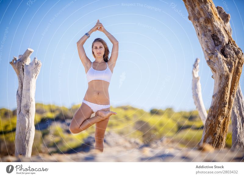Woman doing yoga on beach Beach Yoga Rest Meditation Summer Vacation & Travel Youth (Young adults) Relaxation asana Peace Practice Balance Fitness Zen Calm