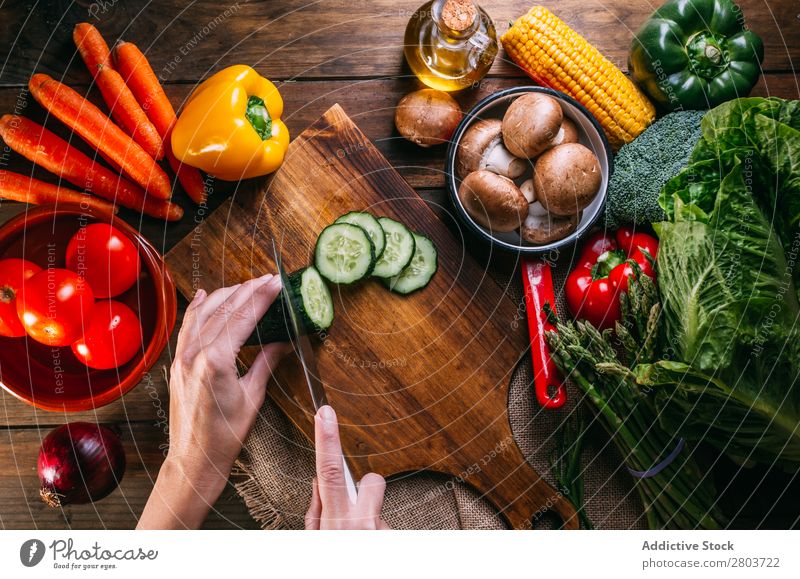 Vegetables and utensils on kitchen table Fresh Vitamin flat lay Oil composition Vertical corn Onion Ingredients Knives Pepper Bird's-eye view Food Cooking Table