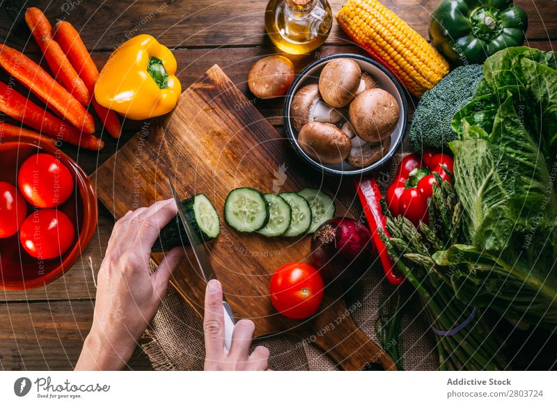 Vegetables and utensils on kitchen table Fresh Vitamin flat lay Oil composition corn Onion Ingredients Knives Pepper Bird's-eye view Food Cooking Table Wood