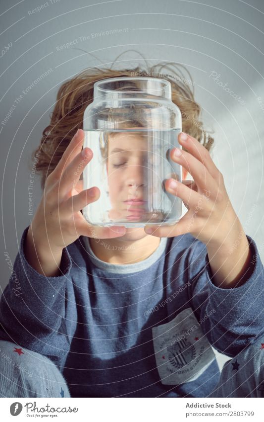 Boy holding vase with water near face Boy (child) Vase Water Clean Transparent Home Wall (building) White Face Easygoing Child Purity Clear Fresh Joy Cute