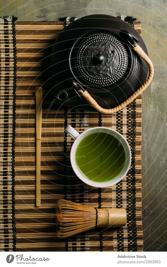 Preparing matcha tea assorted Bamboo Beverage brew Cup Dark Drinking Green Healthy Herbs and spices Japanese Powder Scoop Spoon Tea Teapot Water Beater Wood